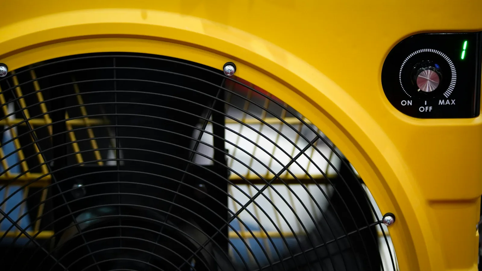 Yellow air mover used to dry wet rooms, one of the line items in water damage restoration cost